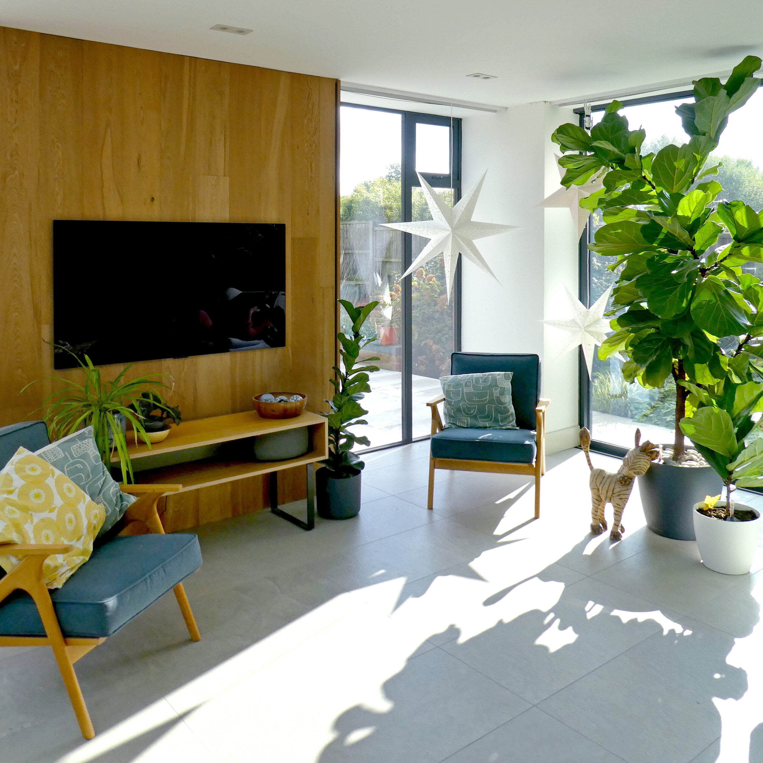 South facing window with light and shadow and seating. Keri Barr Architects in Cockfosters.